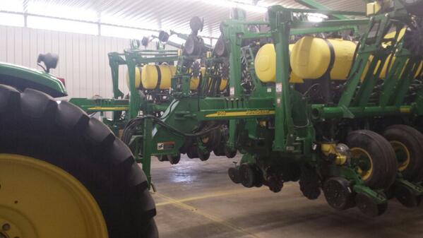 John Deere planter in garage