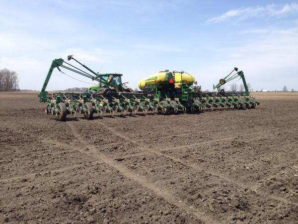 John Deere planter on dirt field