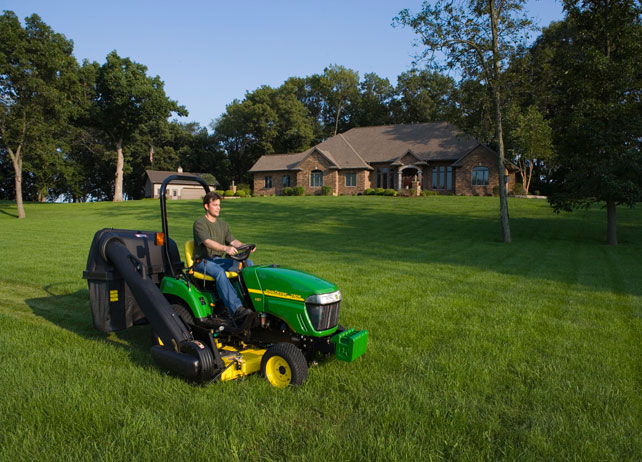 Man on John Deere Riding Mower 