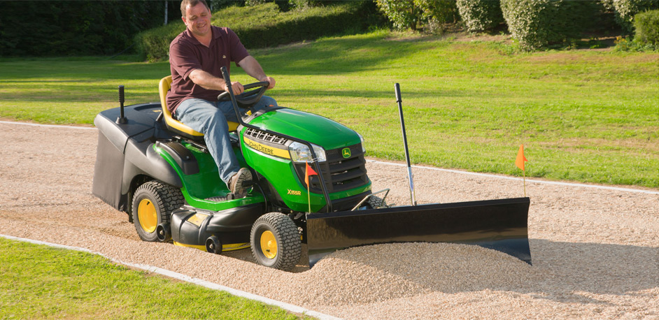 John Deere Mower Pushing Gravel 