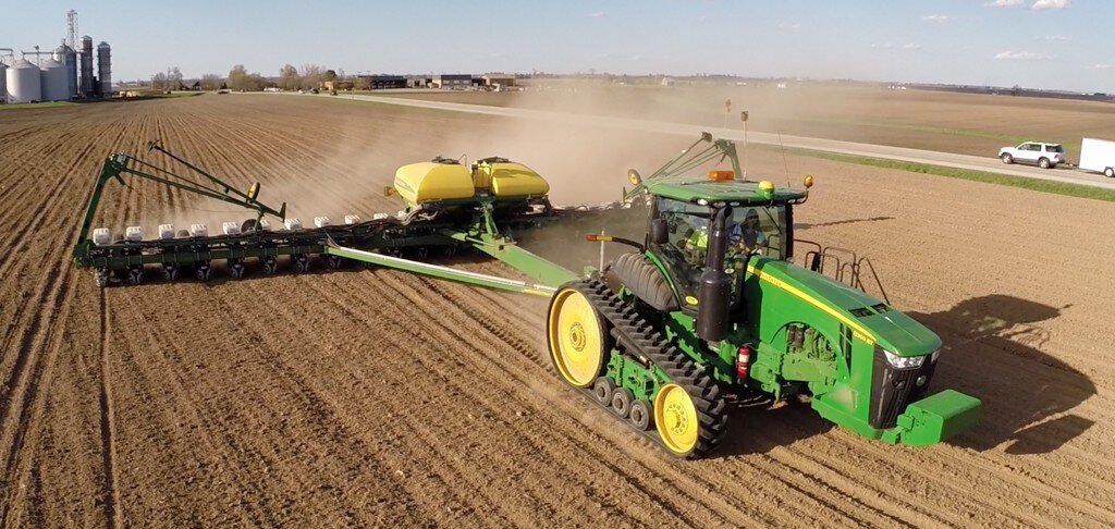 John Deere planter on field near road