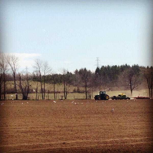 John Deere planter on field in distance